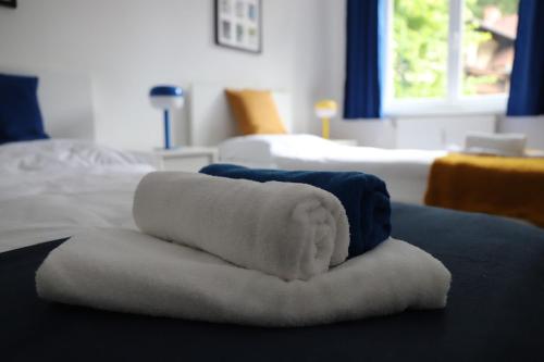 a pile of towels sitting on top of a bed at chill-in Orange - Pure Nature und Relax in Kirchberg am Wechsel
