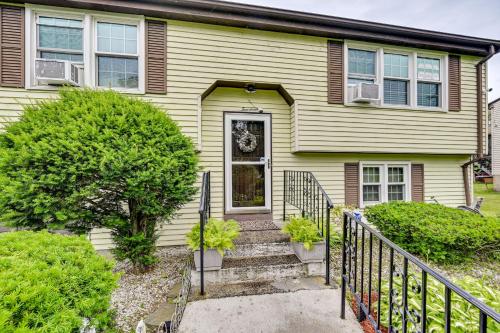 a house with a staircase leading to the front door at Vintage Windsor Home Private Yard and Covered Deck in Windsor