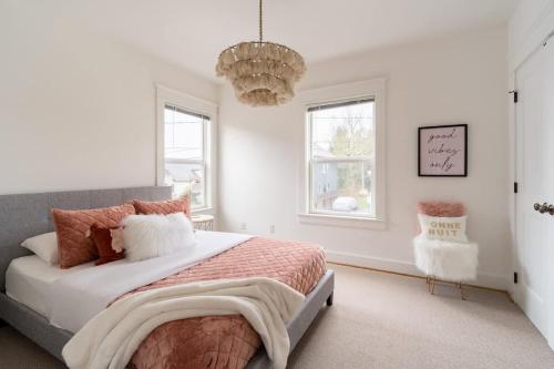 a bedroom with a large bed and a chandelier at The Bohemian Spirit - Live Music, Eateries & Bars in Portland