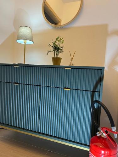 a blue cabinet with a plant on top of it at Fantasticasa in Nettuno