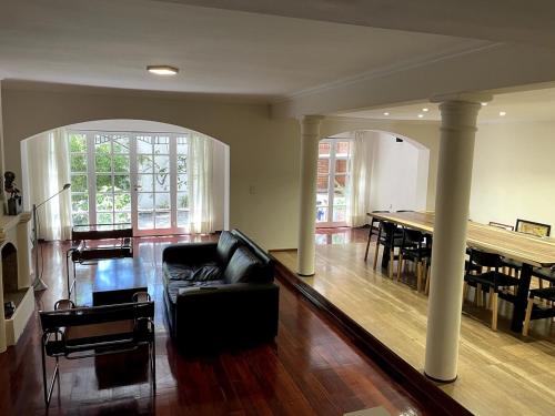 a living room with a couch and a table at Chalet del Hijo Prodigo-wine&suites in Mendoza