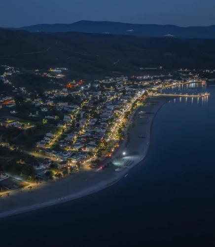 an aerial view of a beach at night at Rozy Studios in Pefki