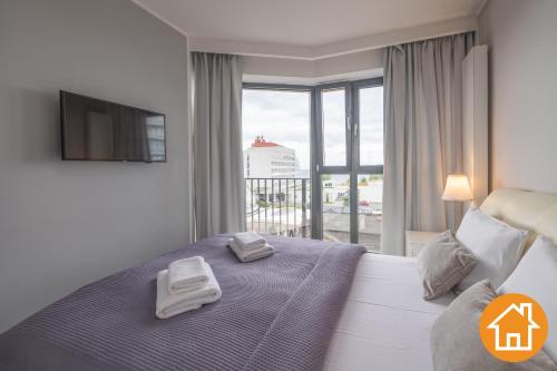 Posteľ alebo postele v izbe v ubytovaní Apartamenty Horyzont - visitopl