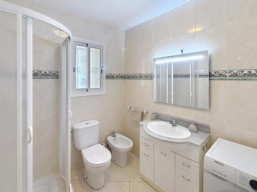a bathroom with a toilet and a sink at El Mirador de Peñiscola in Peñíscola