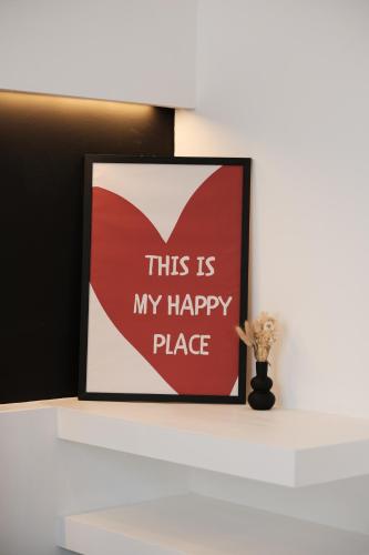 a picture of a heart on a white shelf at Radici Suites in Lecce