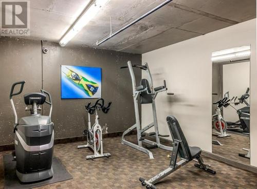 a gym with several exercise bikes in a room at Luxury Two Bedroom Condo near Canmore Banff in Dead Man's Flats