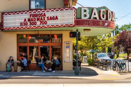 a group of people sitting outside of a restaurant at Stay Portland - Moab Vibes in PDX- Walk to Local Coffee & Food in Portland