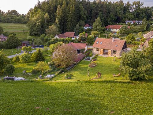 an aerial view of a house on a green field at Stodola 63 in Pacov