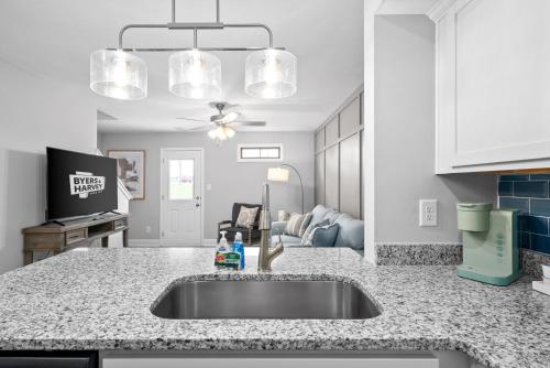 a kitchen with a sink and a living room at Unit #801 Peachers Place Townhomes in Clarksville