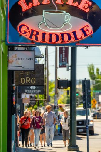 a group of people walking down a sidewalk at Stay Portland - Spacious Restored Craftsmen - Craft Beer & Coffee in Portland