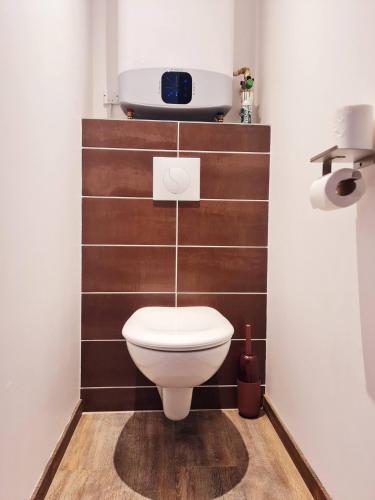 a bathroom with a white toilet in a room at Rep - 4B in Millau
