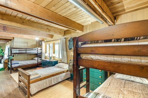 a bedroom with two bunk beds in a house at Canal Across Street Family Cabin in Breezy Point! in Pequot Lakes