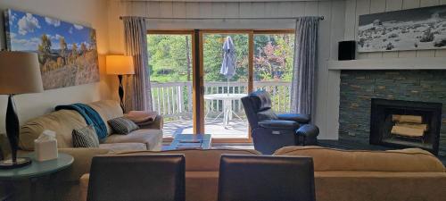 a living room with a couch and a fireplace at On Gore Creek, Pet Friendly, Steps from Free Bus Stop & Great Value in Vail