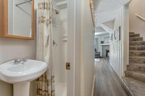a bathroom with a sink and a staircase at On Gore Creek, Pet Friendly, Steps from Free Bus Stop & Great Value in Vail