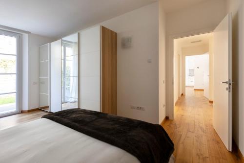 Ένα ή περισσότερα κρεβάτια σε δωμάτιο στο La Residenza sul Mera