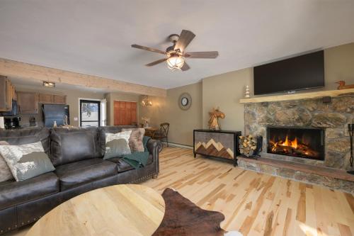 a living room with a couch and a fireplace at Lula in Grand Lake
