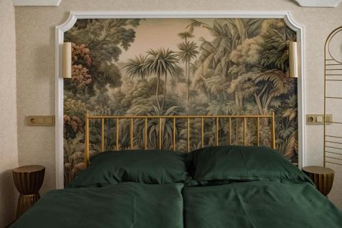 a bedroom with a tapestry behind a bed at Luxury apartments Banská Bystrica on the main square- LUSSO, FRESCO, PURE in Banská Bystrica