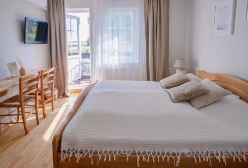 Postel nebo postele na pokoji v ubytování Prie Mariu