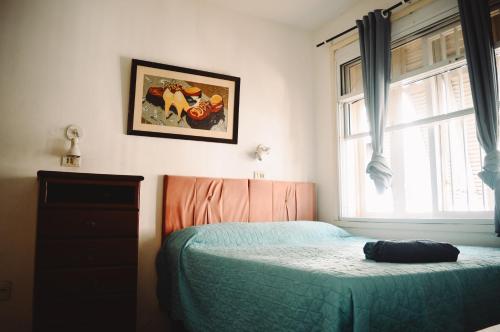 a bedroom with a bed and a window at LiveRio Hostel Ipanema in Rio de Janeiro