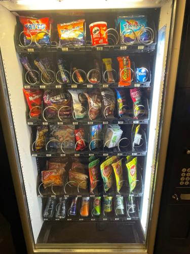 a refrigerator filled with lots of snacks and drinks at Two Bedroom Deluxe Sea View Guest Suite in Inis Mor