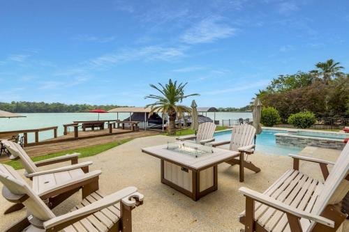 a patio with chairs and a table and a pool at La Costa Drive in Montgomery