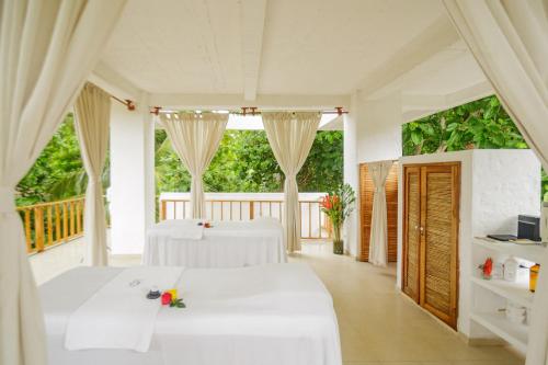 Postel nebo postele na pokoji v ubytování Hotel San Pedro de Majagua