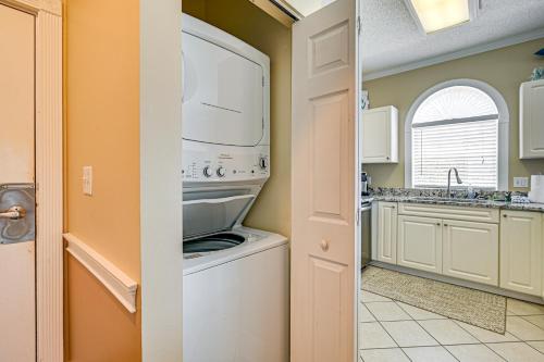 a laundry room with a washer and dryer at 2 Mi to Beach Pool-View Myrtle Beach Escape! in Myrtle Beach