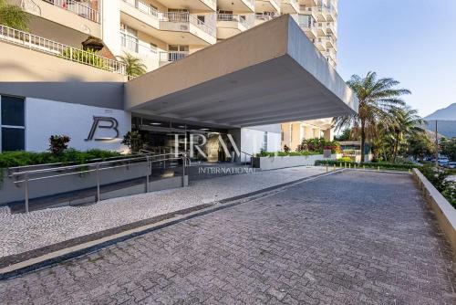 a building with a walkway in front of a building at Barra Palace Hotel in Rio de Janeiro