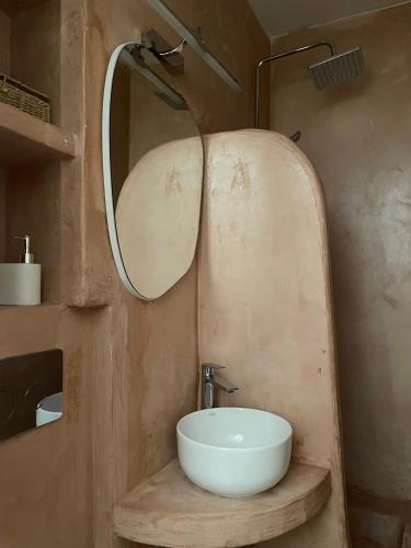 a bathroom with a sink and a mirror at 5 Katsakouli in Mytilini