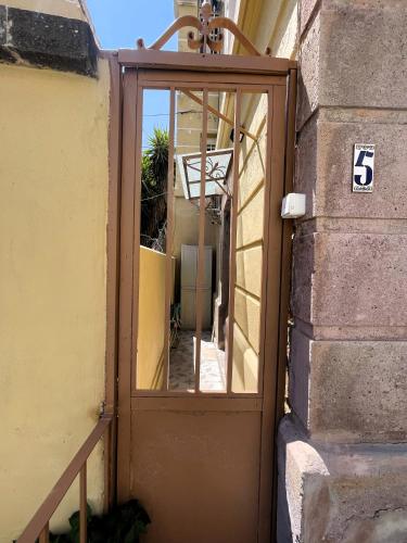 an entrance to a building with a glass door at 5 Katsakouli in Mytilini