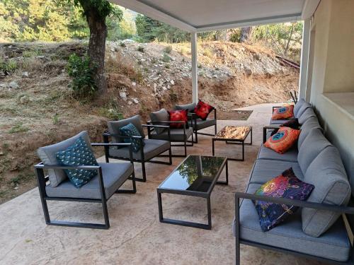 a group of chairs and couches on a patio at Espacio Natal in Valdemanco
