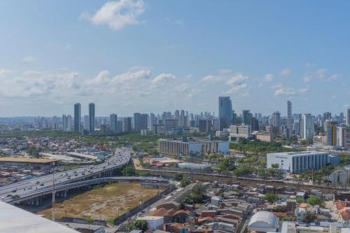 a view of a city with a highway and buildings at Apartamento Vista mar - Cais 410 in Recife