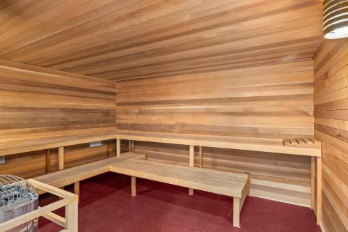 a sauna with wooden walls and wooden benches at Woodbridge Condo by Snowmass Vacations in Snowmass Village