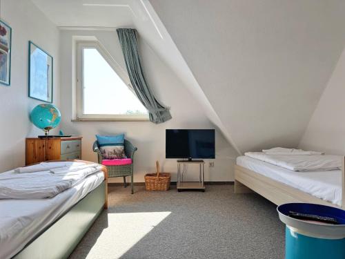 Ένα ή περισσότερα κρεβάτια σε δωμάτιο στο Ferienhaus Lavendel