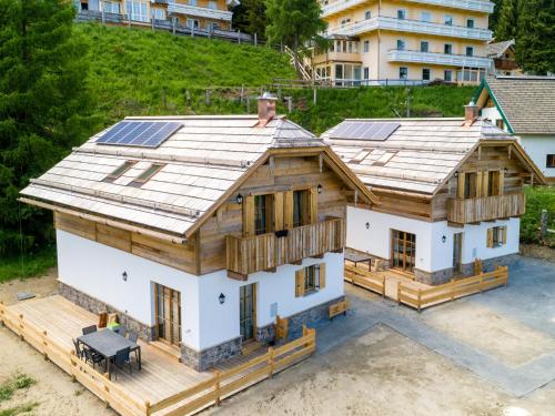 an aerial view of a house with solar panels on the roof at Chalet Petra in Katschberghöhe