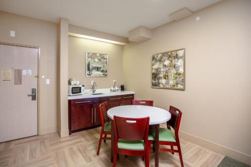 a kitchen with a table and chairs and a sink at Gold Dust West in Carson City