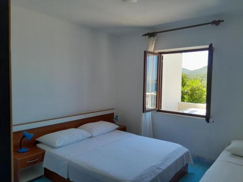 Posteľ alebo postele v izbe v ubytovaní Apartment Pjestata 14440e