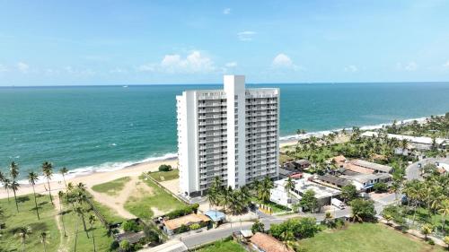 an aerial view of a building next to the beach at Luxury Beachfront Apartment in Wattala