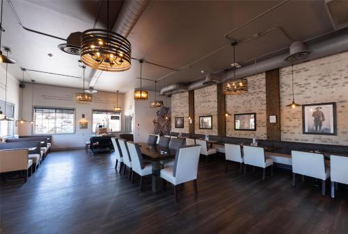 a dining room with a table and chairs at Prestige Radium Hot Springs Resort, WorldHotels Crafted in Radium Hot Springs