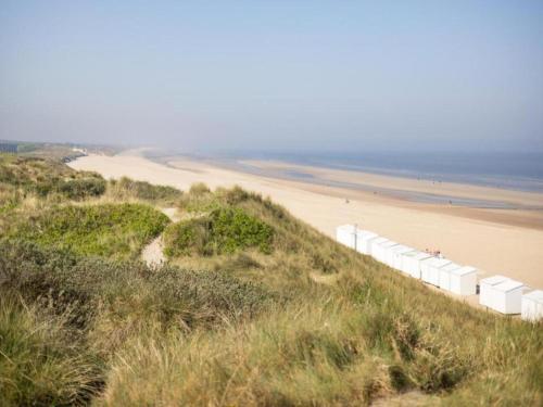 a view of a beach and the ocean from a hill at Villa in Wenduine near the Beach in Wenduine