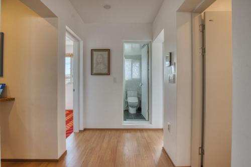 an empty hallway with a toilet in a room at Naksan Balcony in Seoul