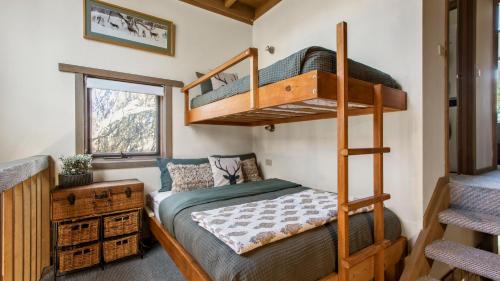 a bedroom with bunk beds in a tiny house at Westons in Dinner Plain