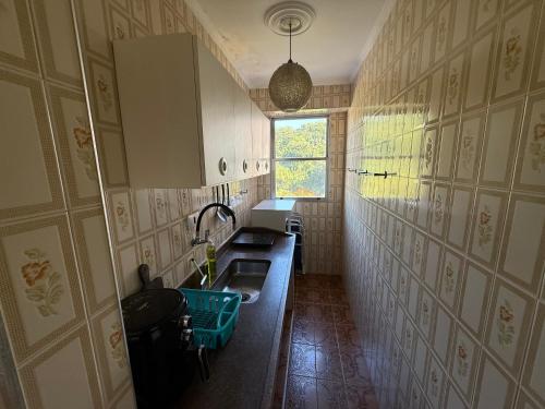 Køkken eller tekøkken på Apartamento Vista da Praia Espetacular!