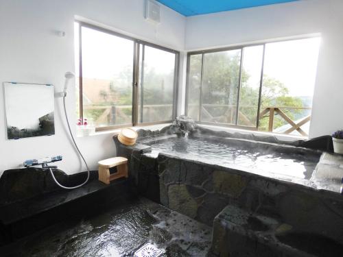 Ein Badezimmer in der Unterkunft 久遠霧島
