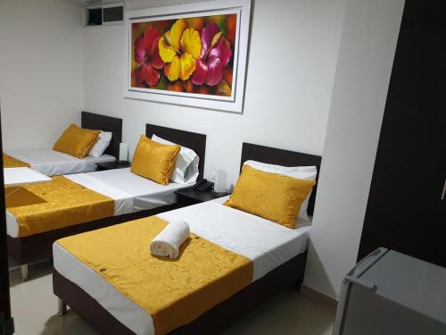 Postel nebo postele na pokoji v ubytování Hotel Girón Plaza