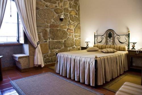 En eller flere senge i et værelse på Quinta do Terreiro - Turismo de Habitacao