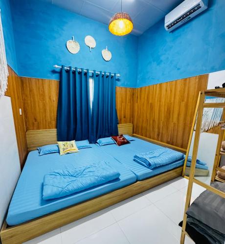 Ένα ή περισσότερα κρεβάτια σε δωμάτιο στο M91 Homestay
