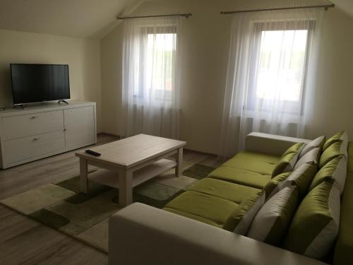 a living room with a couch and a coffee table at Amso Residence in Sibiu