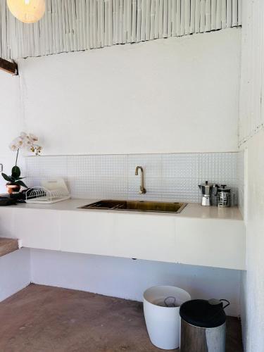 a kitchen with a sink and a counter top at Private Mountain River Cabin in Daraitan Tanay Rizal Philippines in Tanay