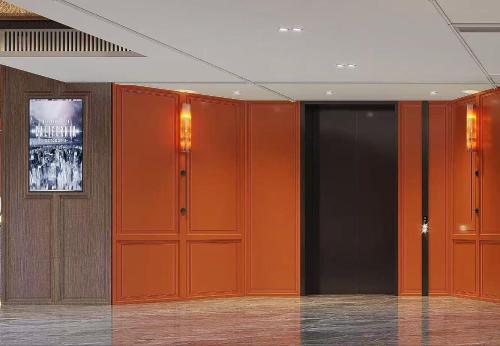 an empty room with orange and black walls at Five Rams City Hotel in Guangzhou